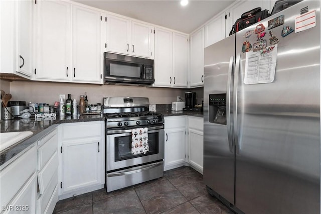 kitchen featuring white cabinets and appliances with stainless steel finishes
