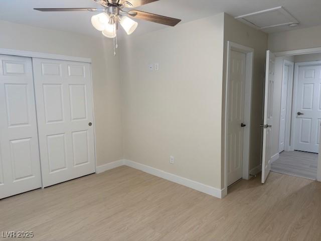 432 Anchor St, Las Vegas, NV 89110 - unfurnished bedroom with a closet, baseboards, a ceiling fan, light wood finished floors, and attic access