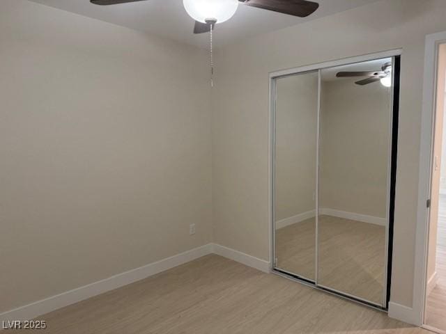 432 Anchor St, Las Vegas, NV 89110 - unfurnished bedroom with wood finished floors, a closet, and baseboards