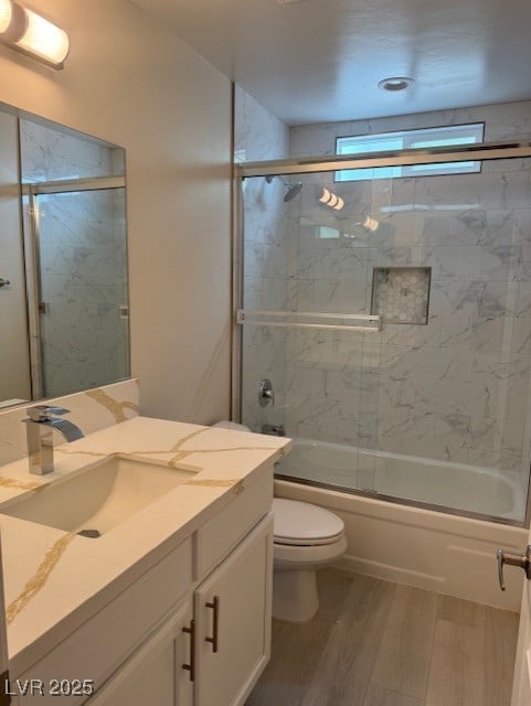 432 Anchor St, Las Vegas, NV 89110 - full bathroom with combined bath / shower with glass door, vanity, toilet, and wood finished floors