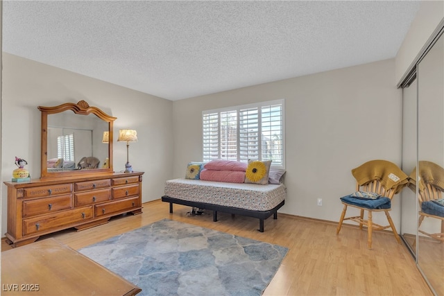 468 Potomac St, Henderson, NV 89015 - bedroom featuring a textured ceiling, wood finished floors, and a closet