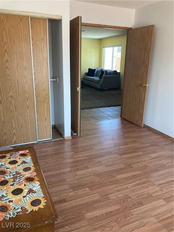 468 Potomac St, Henderson, NV 89015 - bedroom featuring wood finished floors, baseboards, and a closet
