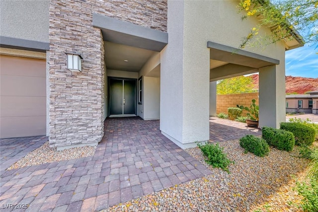 109 Reverie Heights Ave, Henderson, NV 89011 - property entrance with stone siding and stucco siding