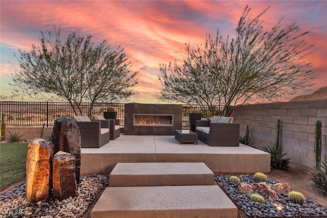109 Reverie Heights Ave, Henderson, NV 89011 - fenced backyard featuring a patio and an outdoor living space with a fireplace