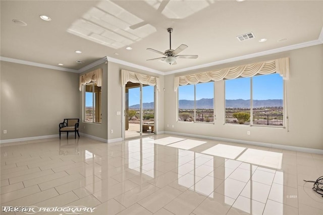 spare room with a mountain view, crown molding, visible vents, ceiling fan, and recessed lighting