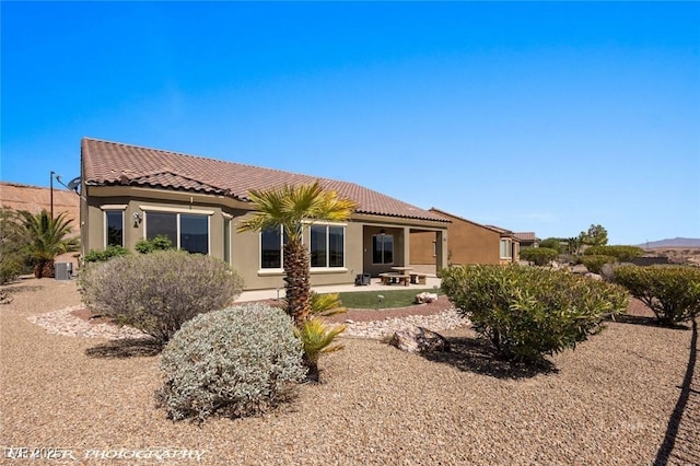 1348 Basin Vw, Mesquite, NV 89034 - rear view of property with a tile roof, stucco siding, a patio, and central AC