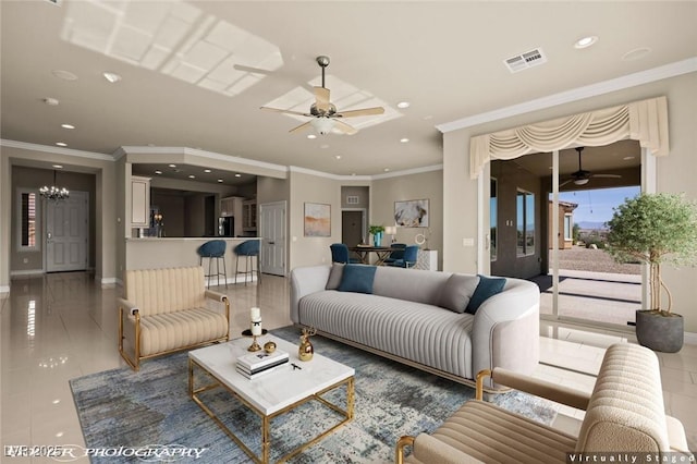 living area with ceiling fan with notable chandelier, baseboards, visible vents, and recessed lighting