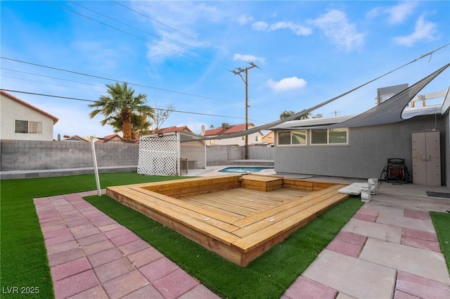 view of yard with a patio, a fenced backyard, and a hot tub