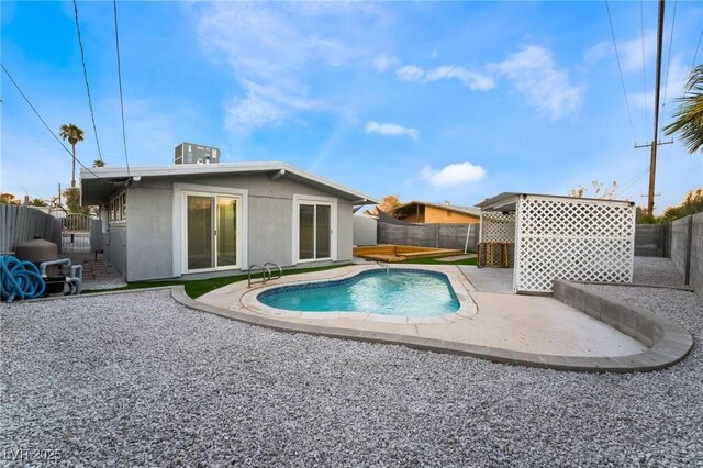 view of pool featuring a fenced backyard, a fenced in pool, and a patio