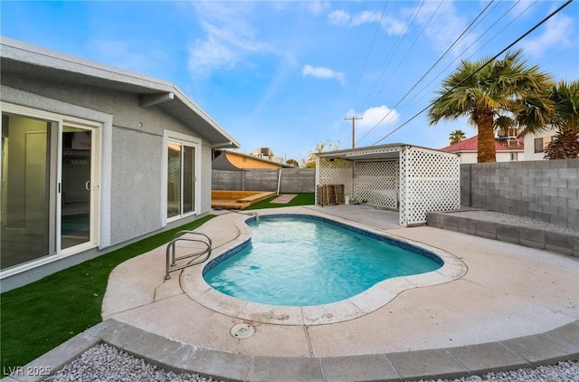 view of swimming pool with a fenced in pool, a patio area, and a fenced backyard