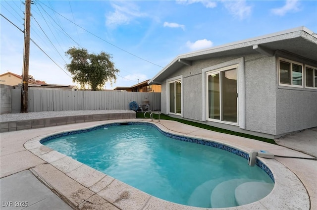view of swimming pool with a patio area, a fenced backyard, and a fenced in pool