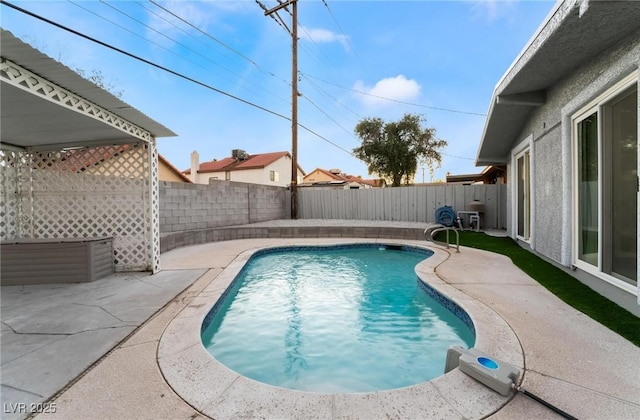view of swimming pool featuring a patio area, a fenced backyard, and a fenced in pool