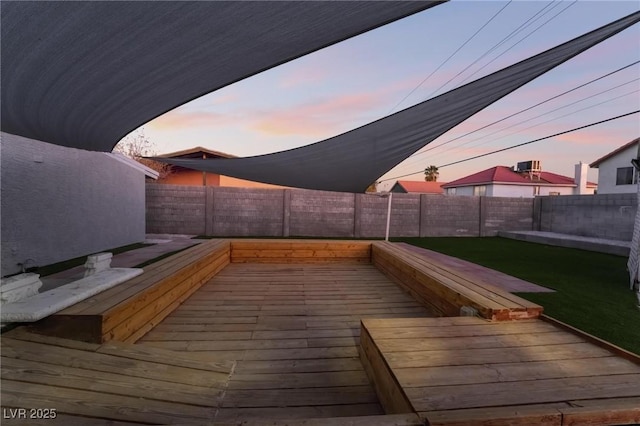 wooden deck featuring a fenced backyard