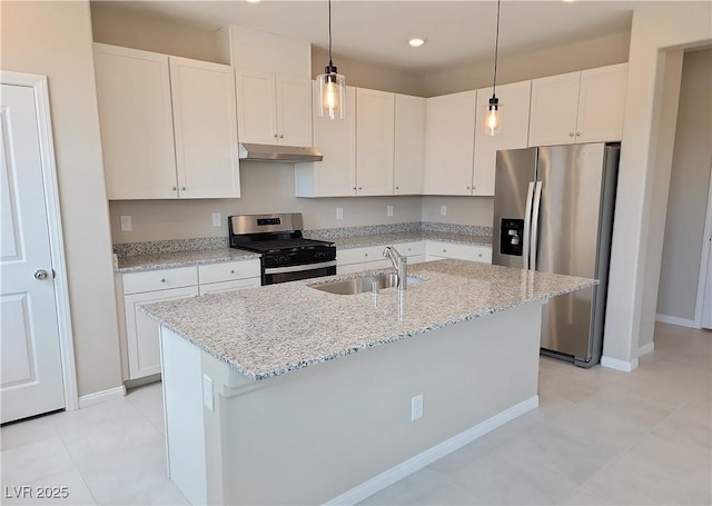 kitchen featuring a sink, white cabinets, appliances with stainless steel finishes, and under cabinet range hood