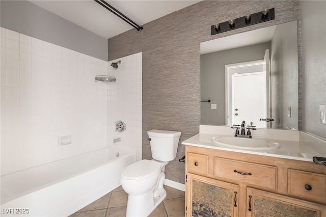 bathroom with tile patterned floors, toilet, shower / bath combination, and vanity