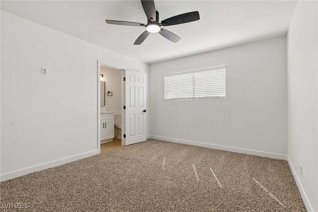 613 Kings Pl, Boulder City, NV 89005 - unfurnished bedroom with connected bathroom, baseboards, light carpet, and ceiling fan