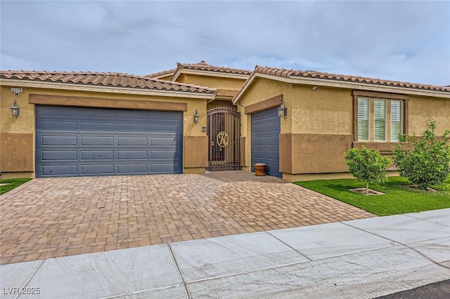 8318 Sonora Del Sol St, Las Vegas, NV 89113 - view of front of property featuring decorative driveway, a garage, and stucco siding