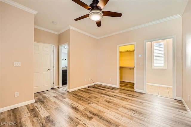 8318 Sonora Del Sol St, Las Vegas, NV 89113 - unfurnished bedroom featuring crown molding, light wood-type flooring, baseboards, a walk in closet, and a closet