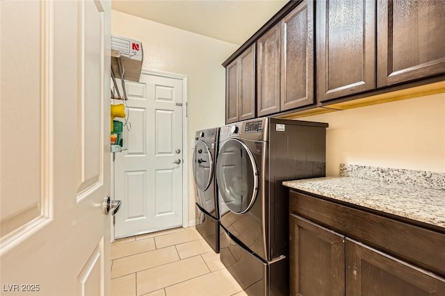 8318 Sonora Del Sol St, Las Vegas, NV 89113 - laundry room featuring cabinet space, washing machine and clothes dryer, and light tile patterned floors
