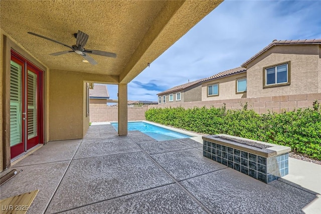 8318 Sonora Del Sol St, Las Vegas, NV 89113 - fenced backyard with ceiling fan and a patio area