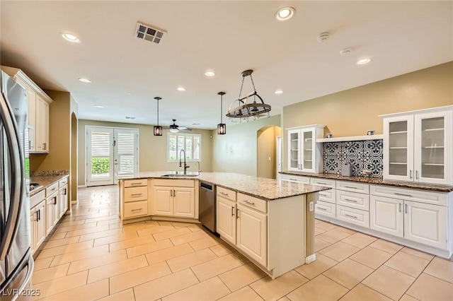 8318 Sonora Del Sol St, Las Vegas, NV 89113 - kitchen with a sink, arched walkways, stainless steel dishwasher, a ceiling fan, and recessed lighting