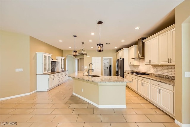 8318 Sonora Del Sol St, Las Vegas, NV 89113 - kitchen featuring wall chimney range hood, a sink, tasteful backsplash, appliances with stainless steel finishes, and recessed lighting
