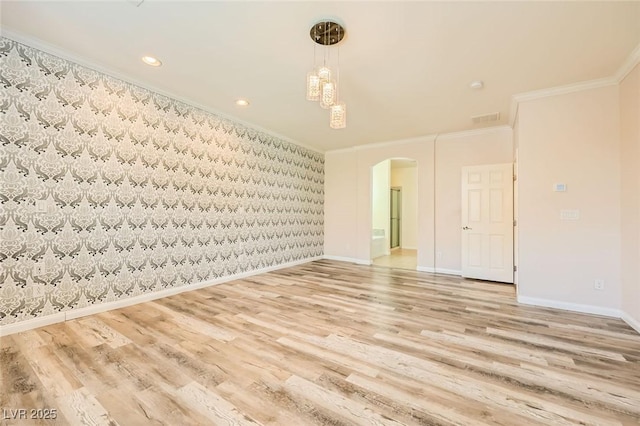 8318 Sonora Del Sol St, Las Vegas, NV 89113 - empty room with wallpapered walls, ornamental molding, arched walkways, baseboards, and wood finished floors