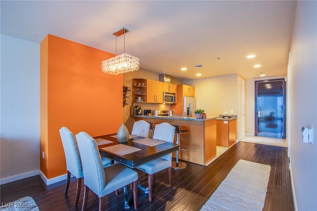 4525 Dean Martin Dr Unit 1103, Las Vegas, NV 89103 - dining area featuring visible vents, baseboards, a chandelier, recessed lighting, and hardwood / wood-style floors