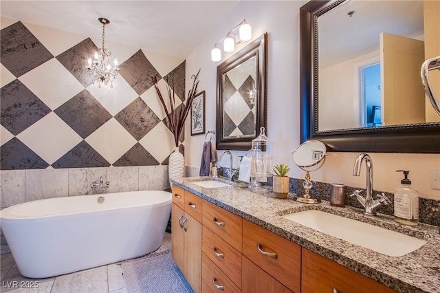 4525 Dean Martin Dr Unit 1103, Las Vegas, NV 89103 - full bathroom with a sink, an inviting chandelier, double vanity, and a freestanding bath