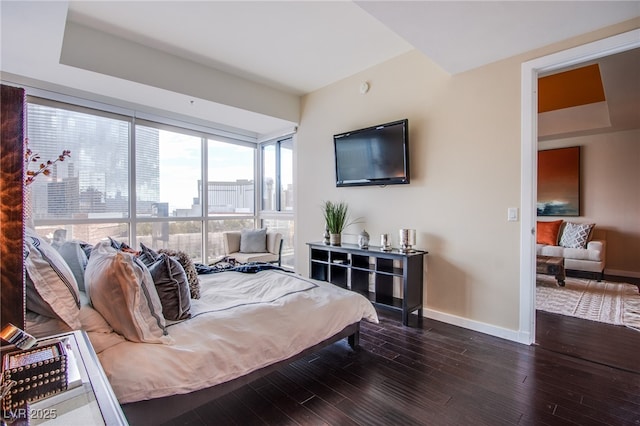 4525 Dean Martin Dr Unit 1103, Las Vegas, NV 89103 - bedroom featuring baseboards and wood finished floors