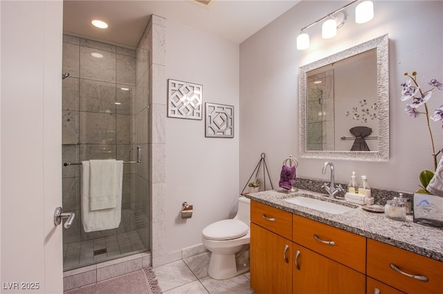 4525 Dean Martin Dr Unit 1103, Las Vegas, NV 89103 - full bathroom featuring tile patterned flooring, vanity, toilet, baseboards, and a shower stall