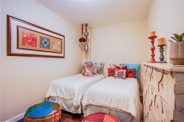 4525 Dean Martin Dr Unit 1103, Las Vegas, NV 89103 - bedroom featuring baseboards and wood finished floors