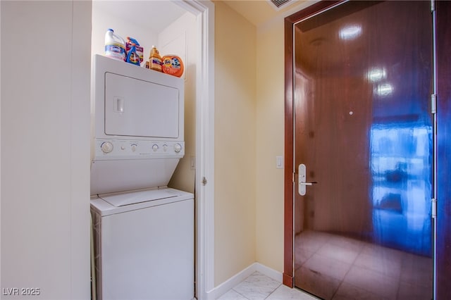 4525 Dean Martin Dr Unit 1103, Las Vegas, NV 89103 - washroom featuring laundry area, baseboards, and stacked washer and clothes dryer