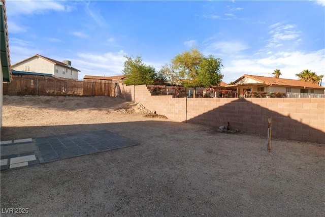 view of yard with a fenced backyard