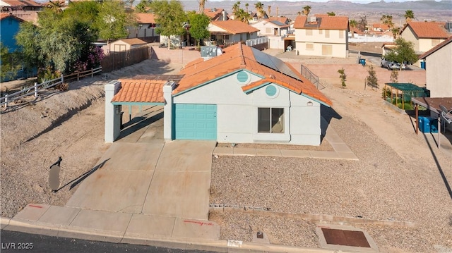 birds eye view of property with a mountain view and a residential view