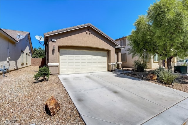 448 Bright Moon Ave, North Las Vegas, NV 89084 - view of front of home featuring stucco siding, driveway, and an attached garage