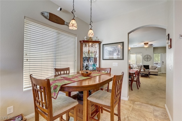 448 Bright Moon Ave, North Las Vegas, NV 89084 - dining area with arched walkways, a ceiling fan, and baseboards