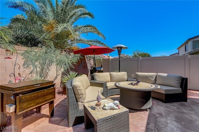 448 Bright Moon Ave, North Las Vegas, NV 89084 - fenced backyard with an outdoor living space and a patio area