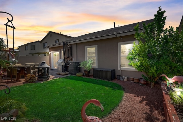 448 Bright Moon Ave, North Las Vegas, NV 89084 - back of house with stucco siding, a patio area, and roof with shingles