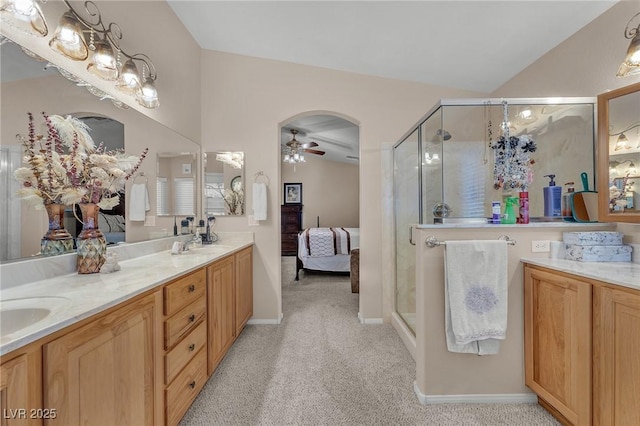 4878 Friar Tuck Ave, Las Vegas, NV 89130 - full bathroom with a ceiling fan, ensuite bathroom, a stall shower, vaulted ceiling, and double vanity