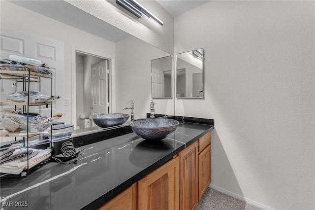 4878 Friar Tuck Ave, Las Vegas, NV 89130 - bathroom featuring vanity, baseboards, and toilet