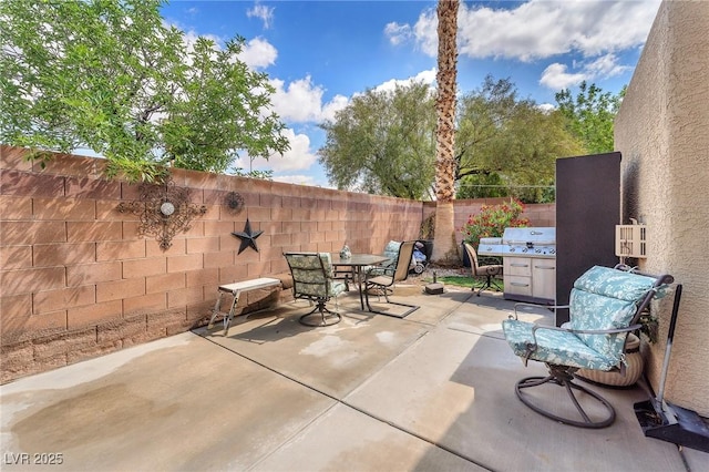 4878 Friar Tuck Ave, Las Vegas, NV 89130 - view of patio featuring outdoor dining area and a fenced backyard