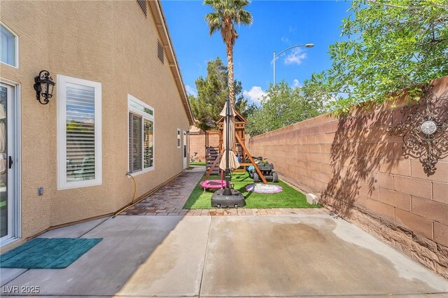 4878 Friar Tuck Ave, Las Vegas, NV 89130 - fenced backyard featuring a patio