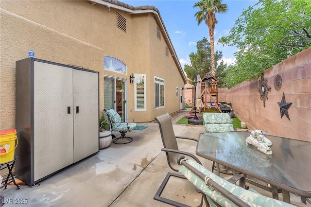 4878 Friar Tuck Ave, Las Vegas, NV 89130 - view of patio / terrace featuring outdoor dining space and a fenced backyard