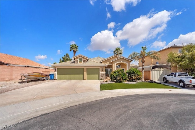 4878 Friar Tuck Ave, Las Vegas, NV 89130 - view of front facade with driveway, a garage, stucco siding, stone siding, and fence