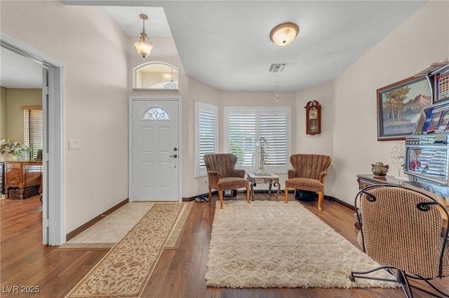 4878 Friar Tuck Ave, Las Vegas, NV 89130 - foyer with healthy amount of natural light, baseboards, and wood finished floors
