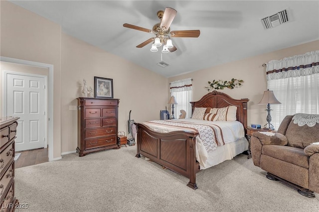 4878 Friar Tuck Ave, Las Vegas, NV 89130 - bedroom with light carpet, vaulted ceiling, a ceiling fan, and baseboards