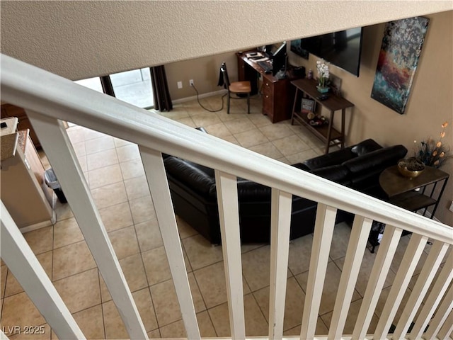 stairs featuring tile patterned floors
