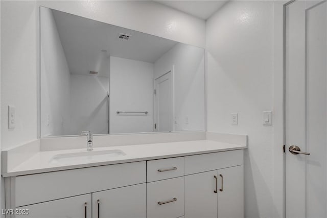 bathroom with visible vents and vanity