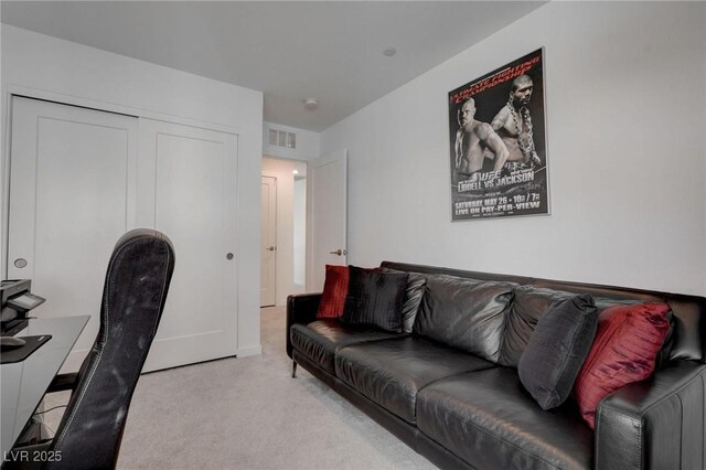 office area featuring visible vents and carpet floors